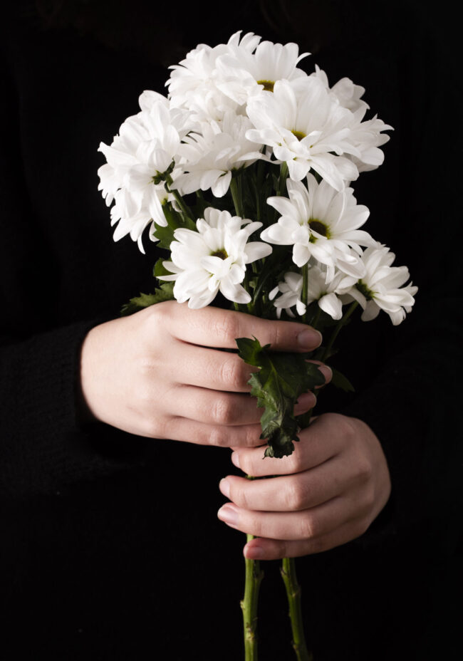 front-view-hands-with-spring-flowers
